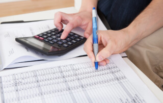 Young couple calculating budget